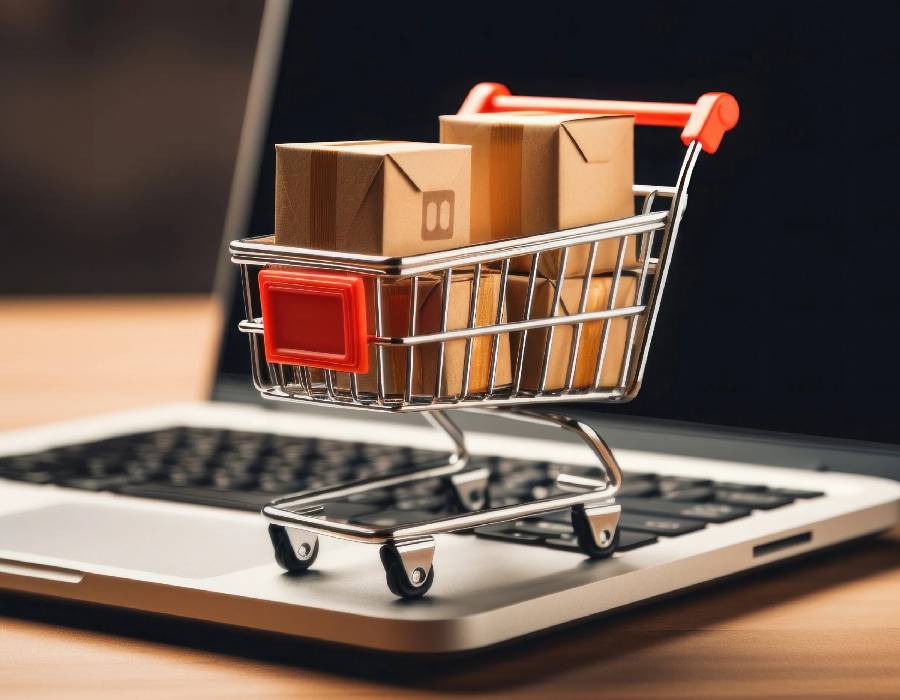 Online shopping on laptop with cart icon - Pexels